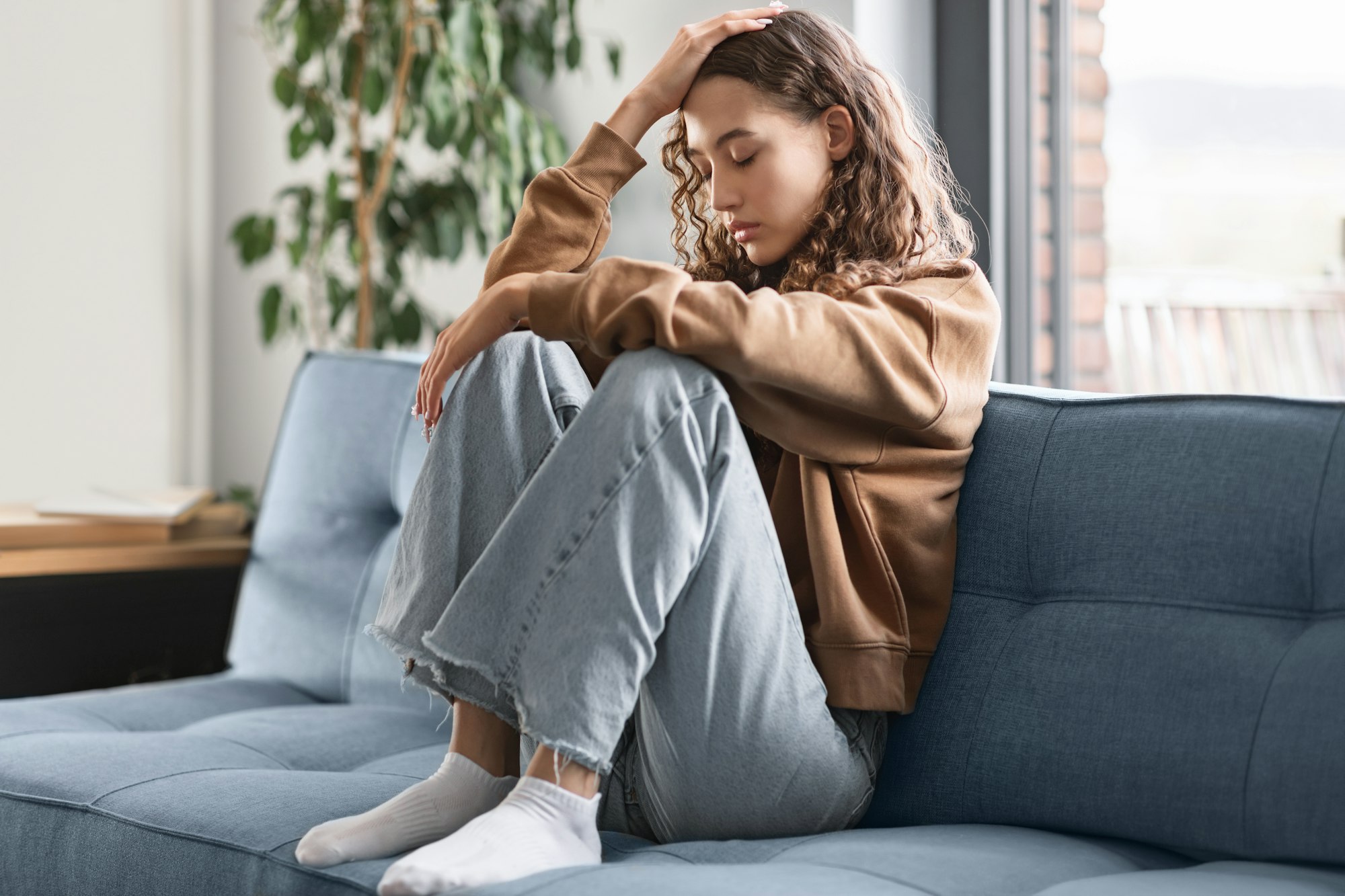 Teen Girl Feeling Sad Suffering From Depressing Thoughts At Home