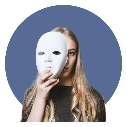 Young woman with light hair hold a blank mask partially obscuring her face.