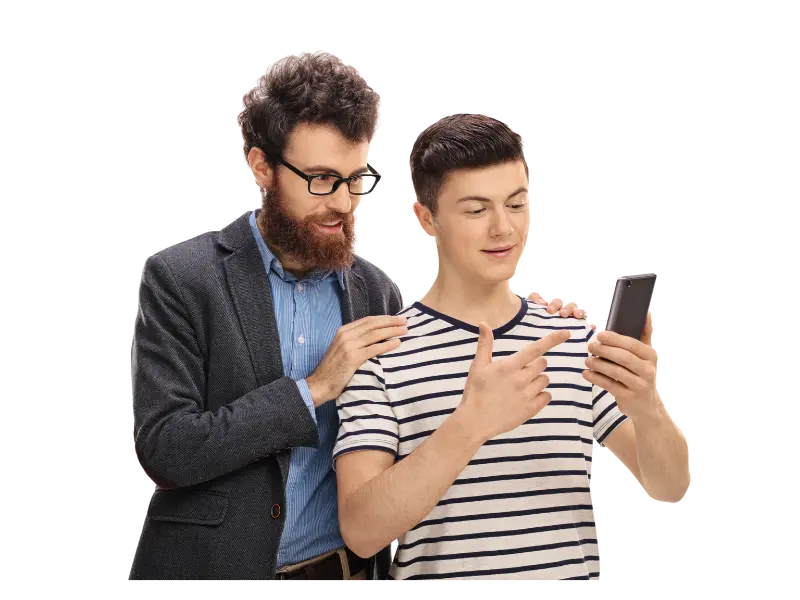 Man and teen look at a phone and talk.