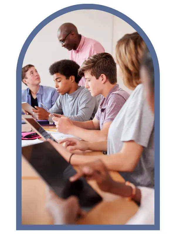 Five students working with an instructor.